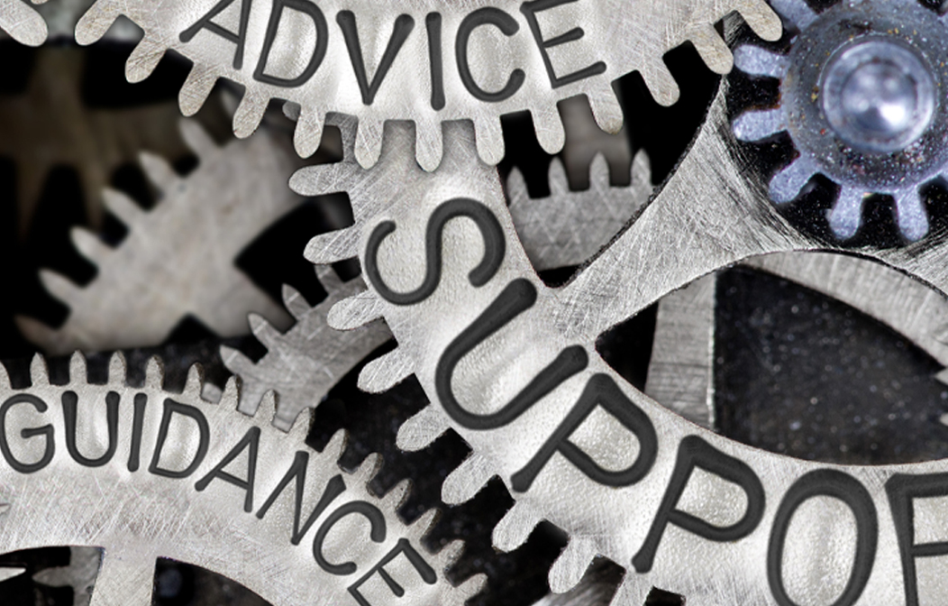 Image of machine cogs with the text "advice", "support" and "guidance" printed on them
